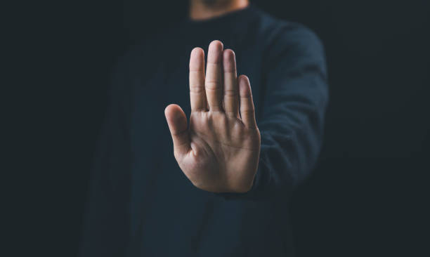 the hand sign of men a stop, caution